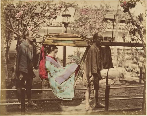 [Japanese Woman in a Chair Carried by Two Men]