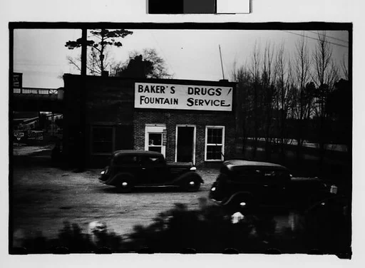 [Drugstore with Parked Cars in Lot, Savannah, Georgia]