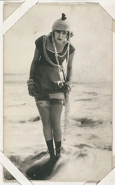Bathing beauty in costume with strands of pearls from Mack Sennett Comedies Arcade series (W423) — Unknown