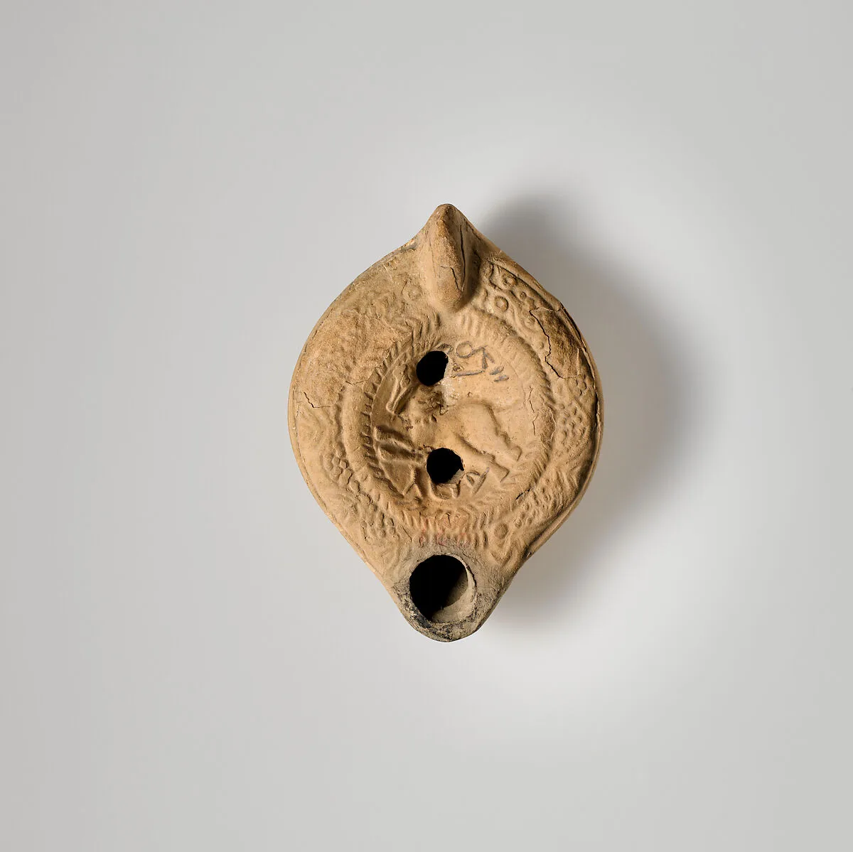 Terracotta oil lamp — Unknown