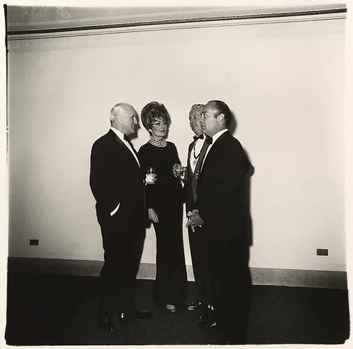 Four people at a gallery opening, N.Y.C.