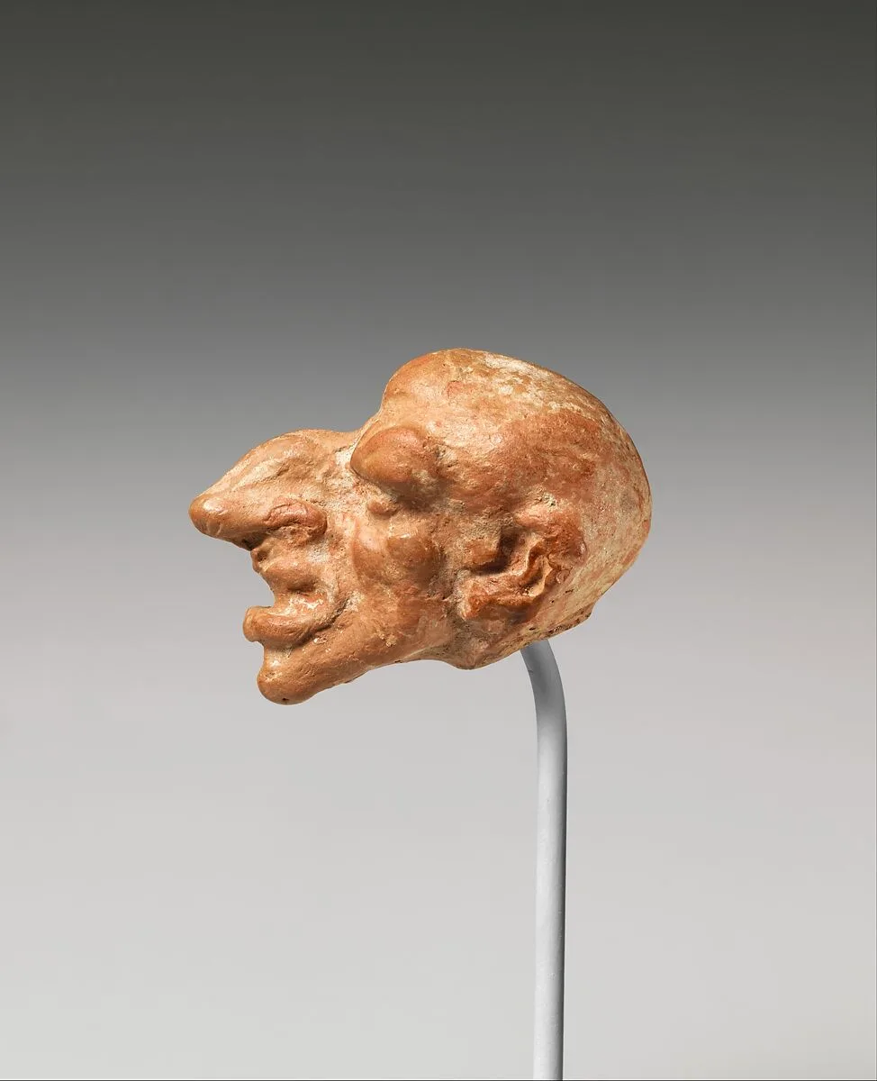 Terracotta head of a male dwarf — Unknown