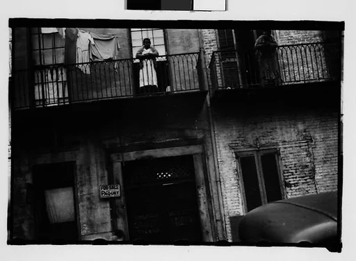 [Shuttered House Façade with Women on Balconies in French Quarter, New Orleans, Louisiana]