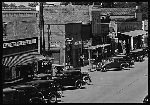 [Parked Cars and Pedestrians on Main Street, Greensboro, Alabama]