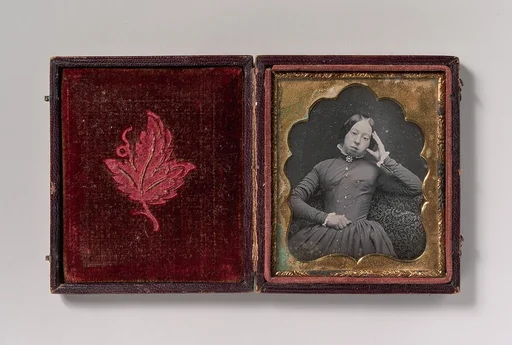 [Seated Woman Wearing Glasses]