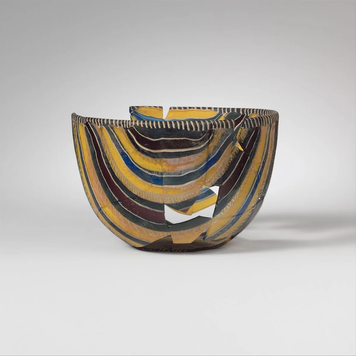 Glass striped mosaic bowl — Unknown