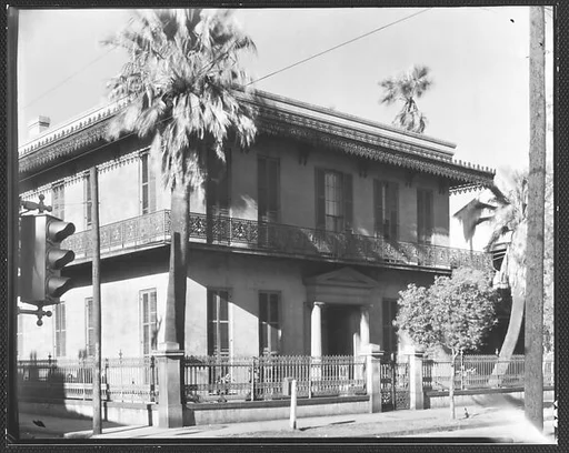 [Cast-Iron Balconied House on Corner with Stoplight in Foreground, New Orleans, Louisiana?]