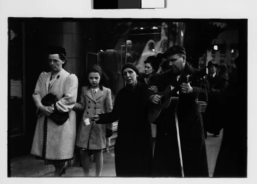 [Five 35mm Film Frames: Blind Street Musicians and Pedestrians on Sidewalk, Chicago, Illinois]