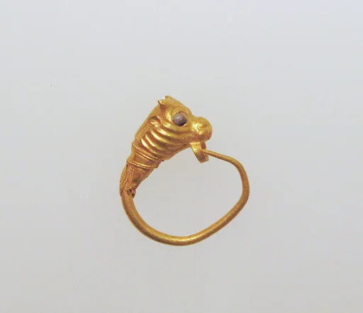 Gold earring with head of a bull