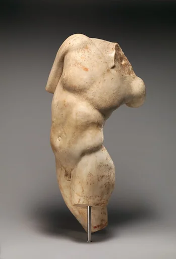 Marble statue of a young satyr turning to look at his tail