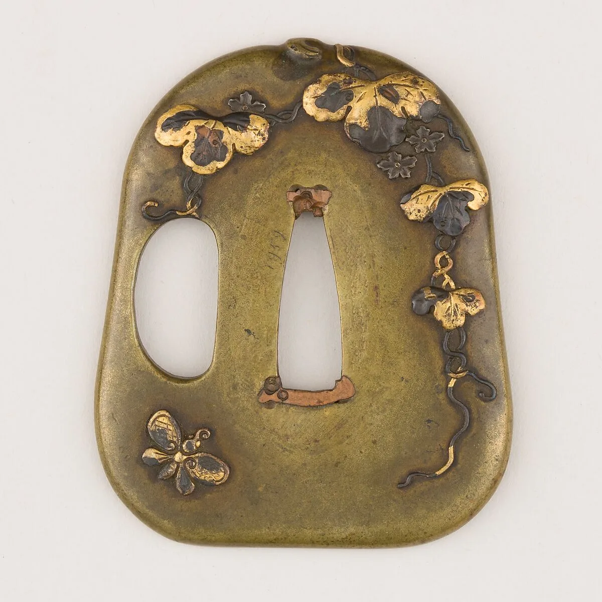 Sword guard (<i>Tsuba</i>) With the Motif of Paulownia Leaves, Tendrils, and Butterfly (蝶に桐唐草図鐔) — Unknown