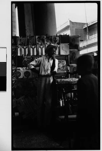 [Young Man in Front of Newspaper Kiosk, Havana]