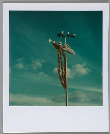 [Angel Ornament Mounted to Light Pole]