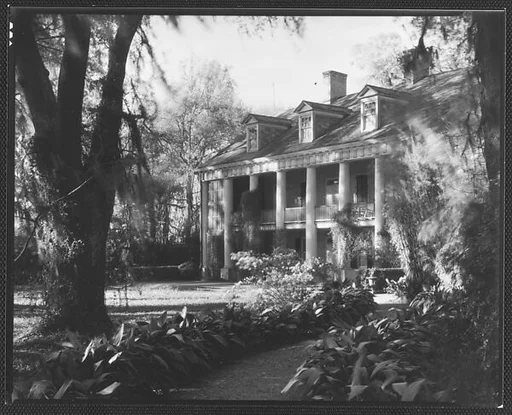 [Brick Greek Revival House with Ivy on Columns, Residence of Weeks Hall, New Iberia, Louisiana]