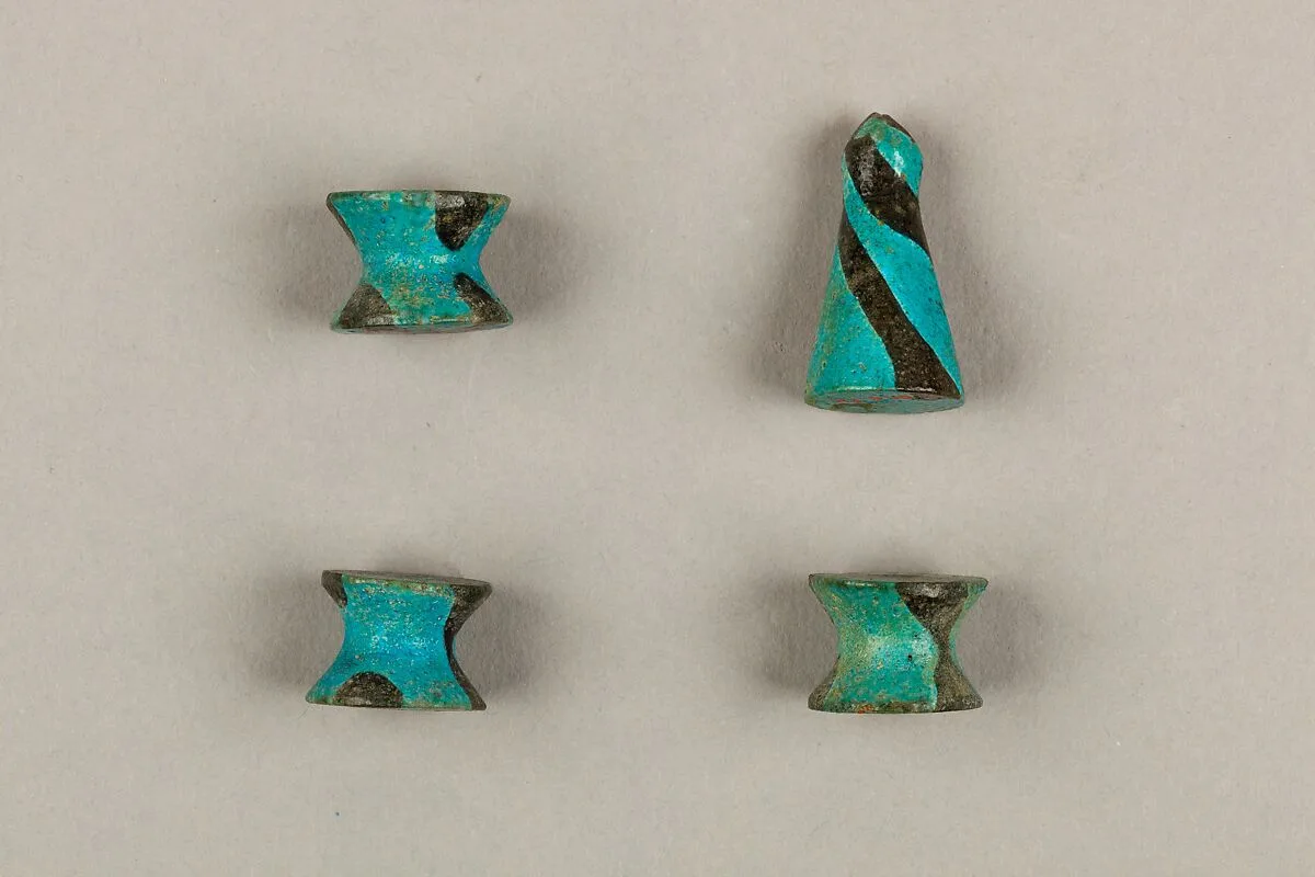 Seven Spool-Shaped Gaming Pieces — Unknown