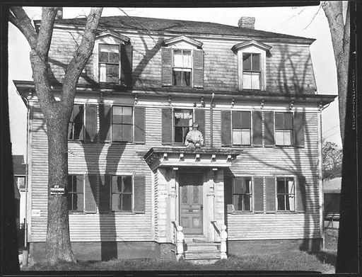 [Greek Revival House with Figurehead Above Entry Porch]
