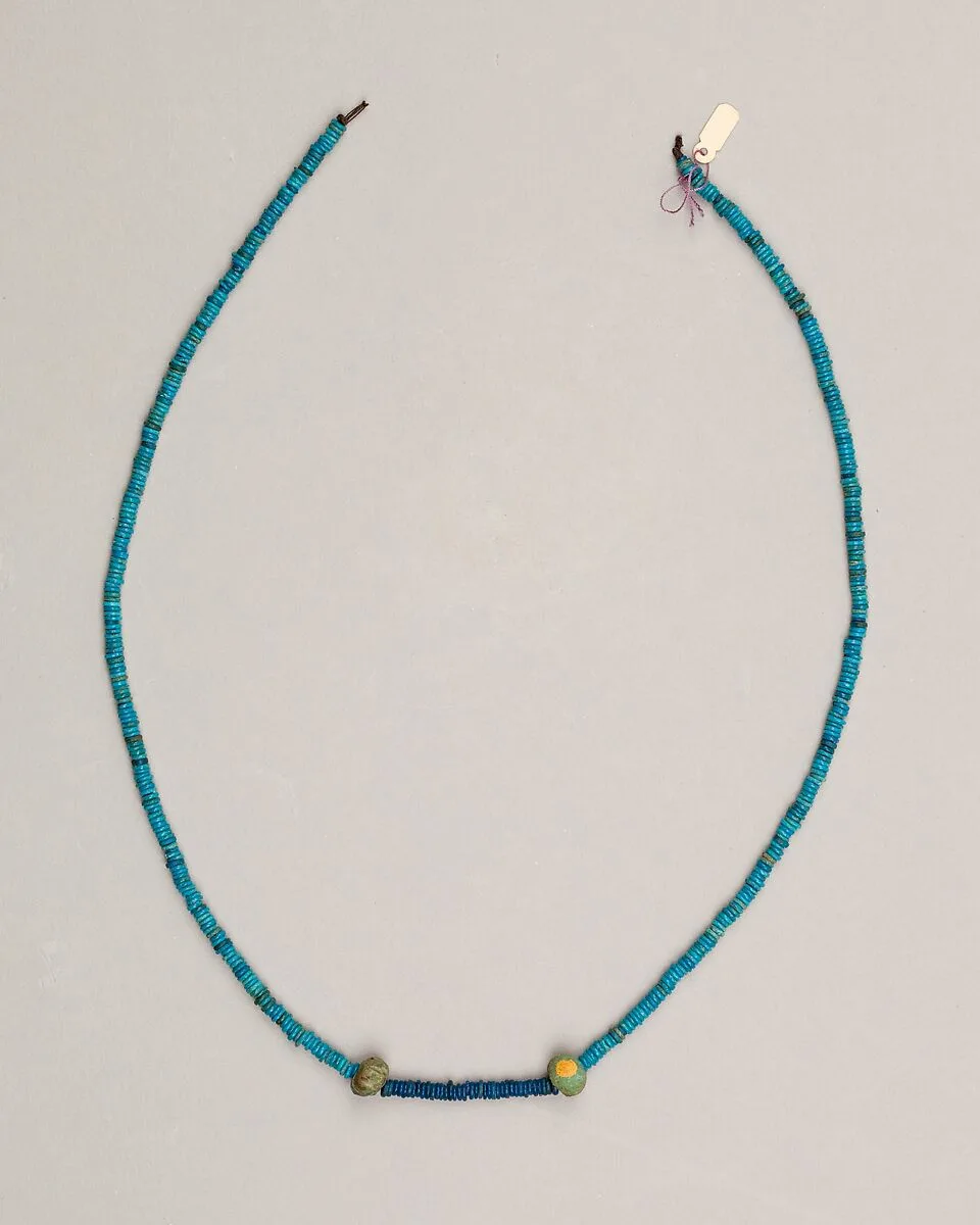 String of ring beads with two ball beads — Unknown
