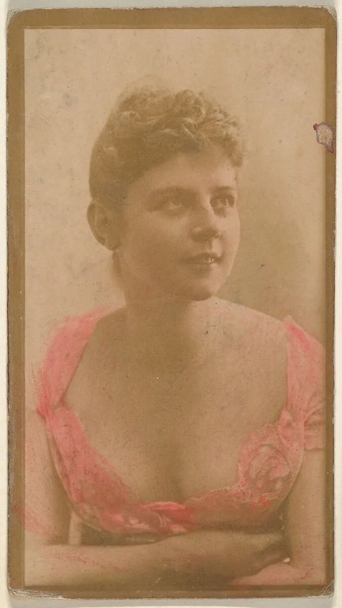 Portrait of actress wearing hand-colored pink dress, from the Actresses series (N668) — Unknown