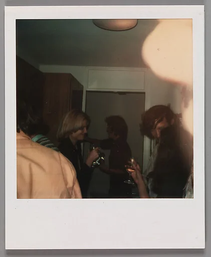 [People Drinking in Kitchen]