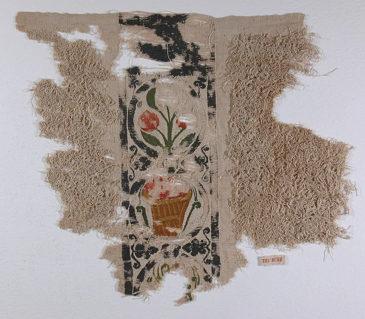 Fragment with a Band of Baskets and Plants and a Loop Pile — Unknown