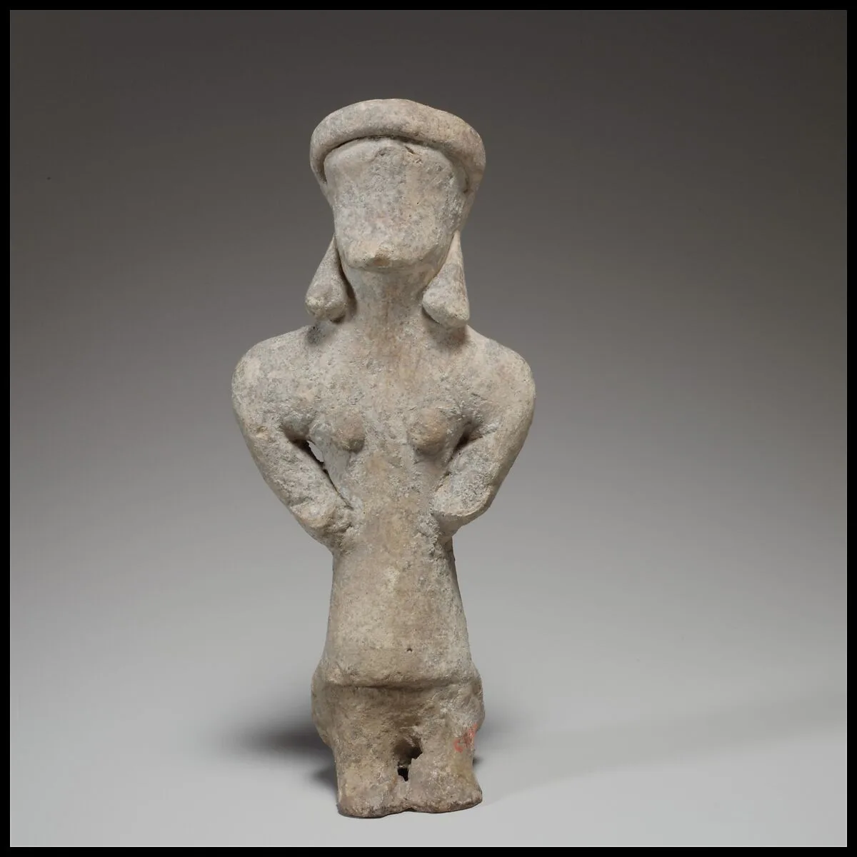 Standing female figurine — Unknown