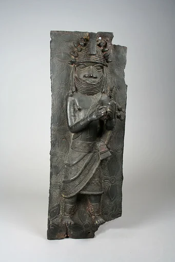 Plaque: Titleholder with Calabash Rattle