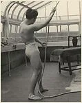 [Male Model Posed Pulling a Rope in Anna Huntington's Rooftop Studio]