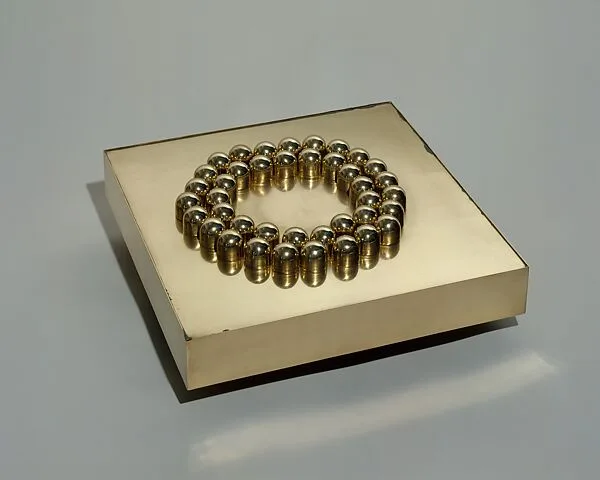 40 Rounded Cylinders on a Base — Pol Bury