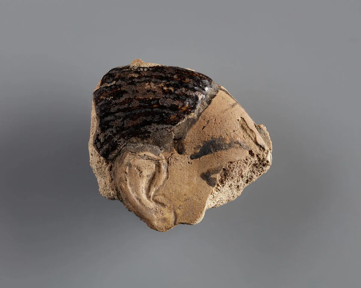 Tile with a fragment of a captive from the palace of Ramesses II — Unknown