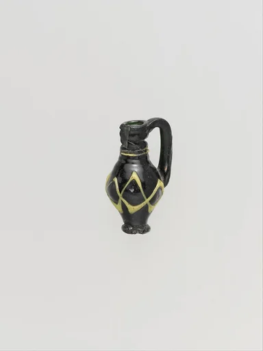 Glass pendant in the form of a miniature jug