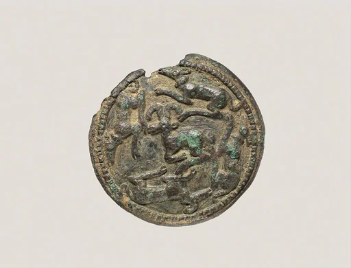 Disc with running dogs surrounding a mountain goat