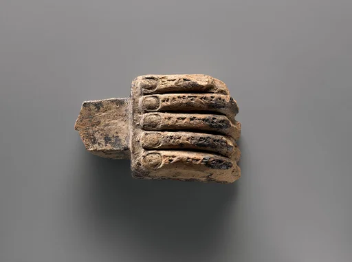 Miniature corbel in the shape of a hand