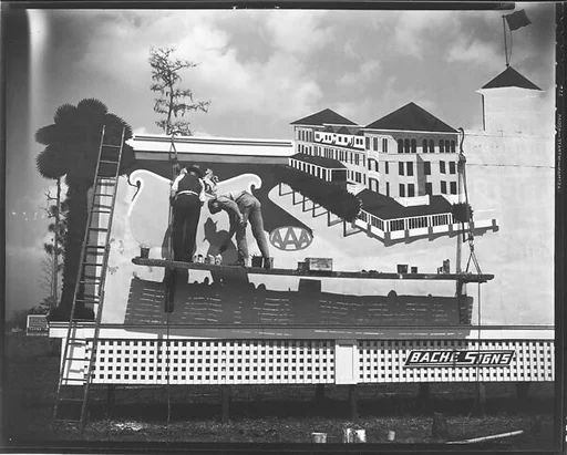 ["AAA" Hotel Billboard with Painters Painting on Scaffolding, Florida]