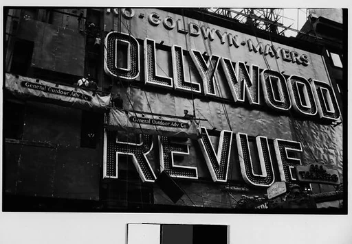 [Workers Mounting Neon Sign for "Hollywood Revue of 1929", Times Square, New York City]