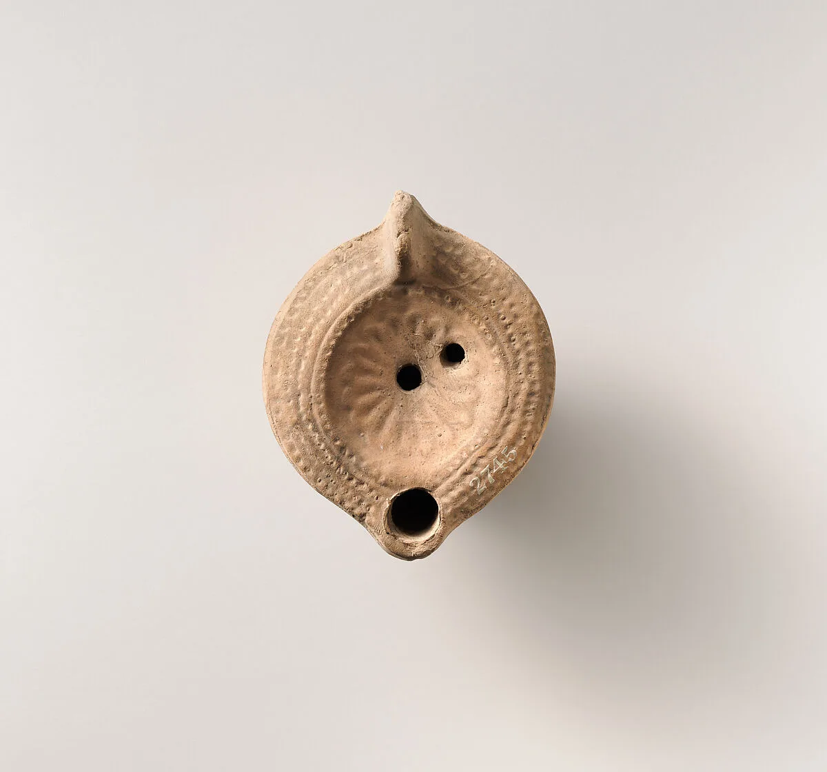 Terracotta oil lamp — Unknown