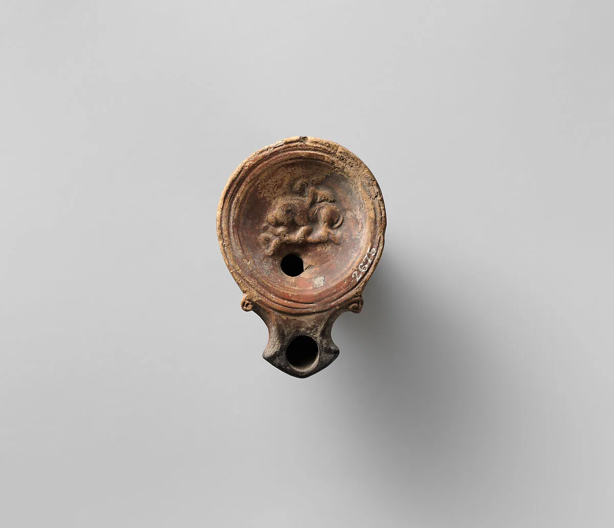 Terracotta oil lamp — Unknown