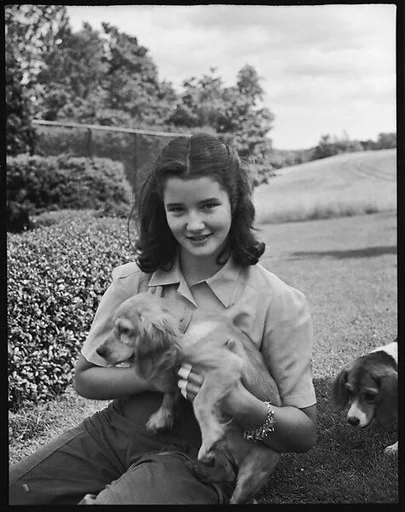 [Wendy Burden Seated on Lawn with Puppy, Bedford, New York]