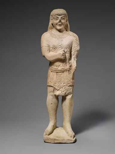 Limestone statuette of a beardless male votary in Egyptianizing dress