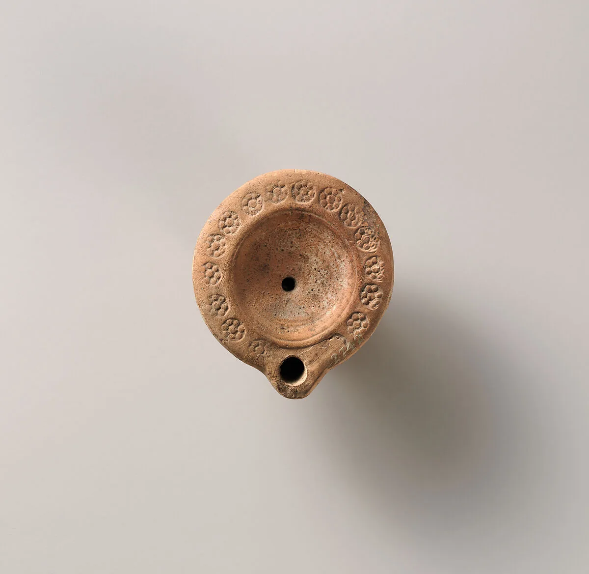 Terracotta oil lamp — Unknown
