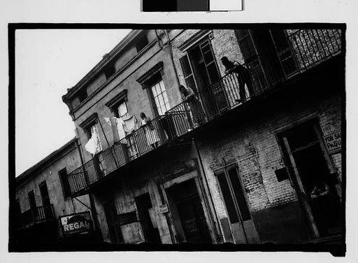 [People on Balconies of Shuttered Houses in French Quarter, New Orleans, Louisiana]