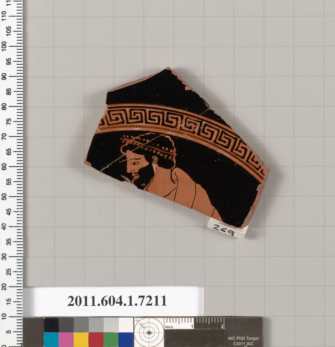 Terracotta fragment of a kylix (drinking cup) — Makron