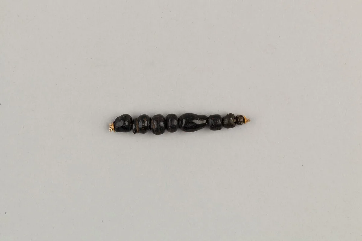 String of 8 beads — Unknown