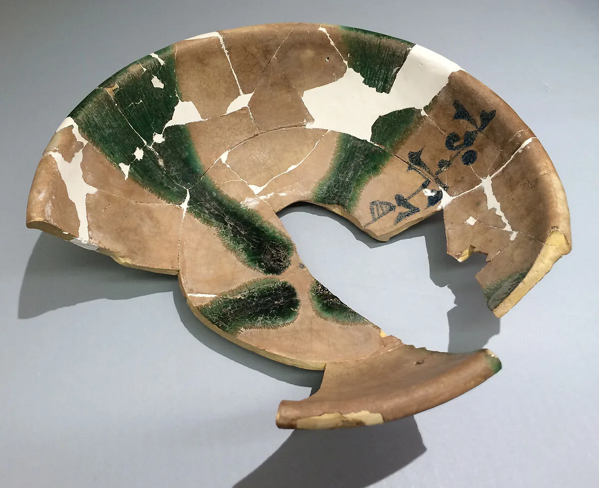 Fragments of a Bowl with Green Splashes and Blue Inscription — Unknown