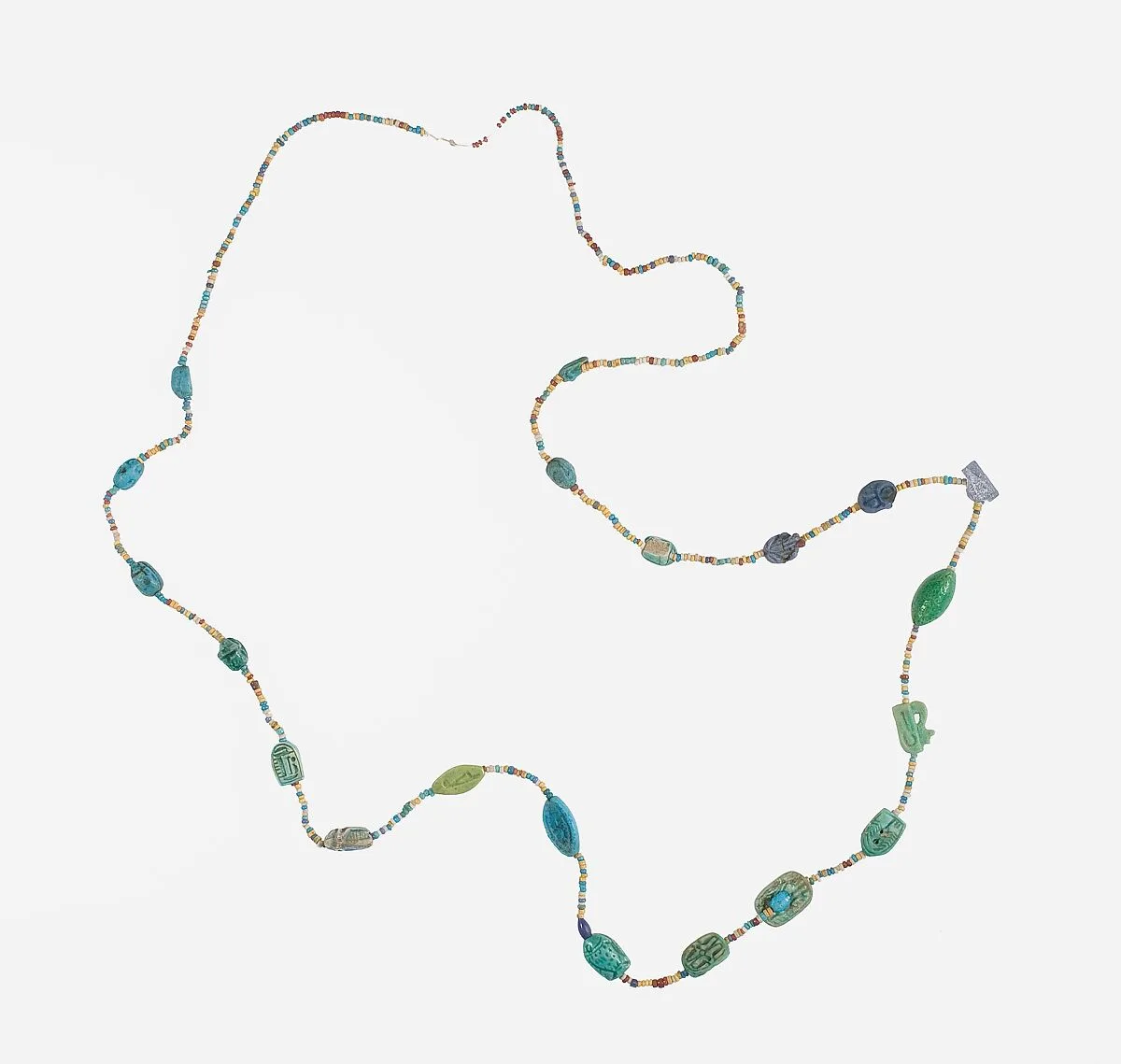 Amulets and string of beads — Unknown
