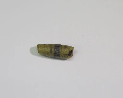 Yellow bead with applied mosaic strips