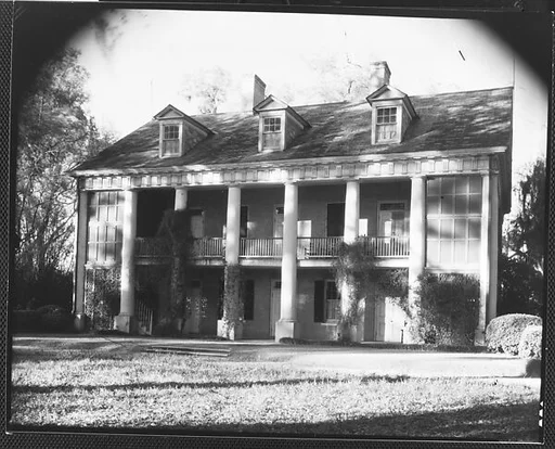 [Brick Greek Revival House with Ivy on Columns, Residence of Weeks Hall, New Iberia, Louisiana]