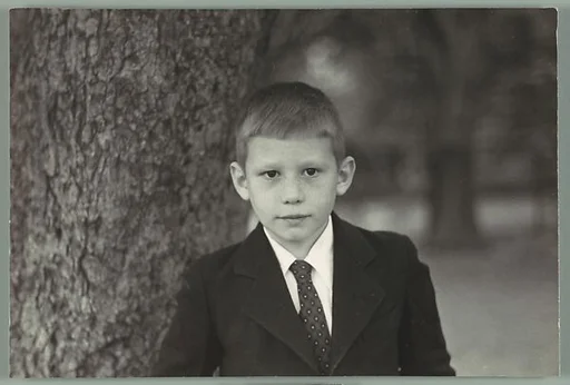 [Eleven Portraits of Young Girl and Boy on Lawn: "Alexander"]