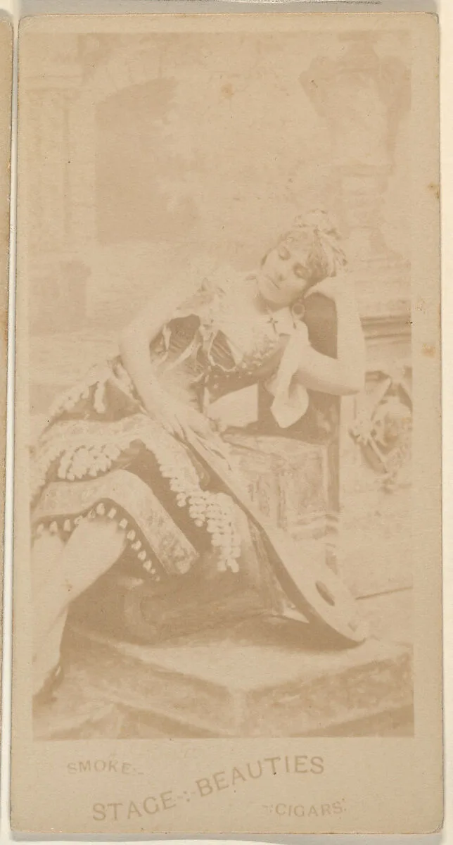 Actress reclining on chair, from the Actresses series (N666) to promote Stage Beauties Cigars — Unknown