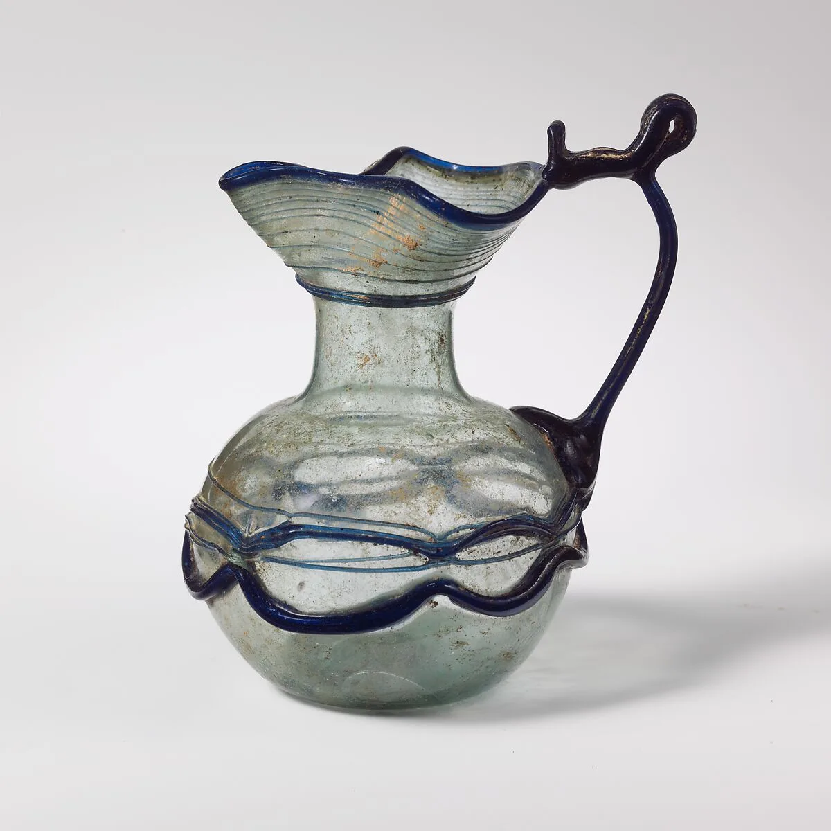 Glass jug with trefoil rim — Unknown