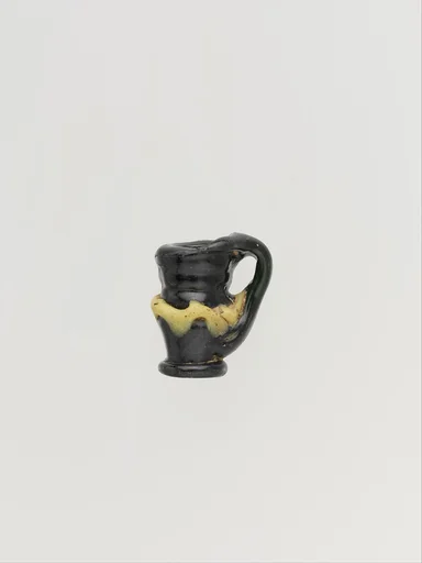 Glass pendant shaped like a jug